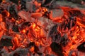Glowing embers in hot red color, abstract background Royalty Free Stock Photo