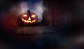 The glowing evil stare of Jack O Latern on the ruins of an old church Royalty Free Stock Photo