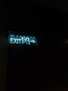 Glowing exit sign in the dark