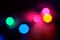 Glowing and festive colored light circles created from in camera and lens bokeh. Christmas fairy lights defocused giving a blurred Royalty Free Stock Photo