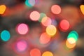 Glowing and festive colored light circles created from in camera and lens bokeh. Christmas fairy lights defocused giving a blurred Royalty Free Stock Photo