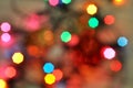 Glowing and festive colored light circles created from in camera and lens bokeh. Christmas fairy lights defocused giving a blurred Royalty Free Stock Photo