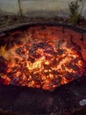 Glowing Fire embers in hot red color, abstract background. The hot embers of burning wood log fire Royalty Free Stock Photo