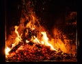 A glowing fire in the stone fireplace