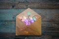 glowing garland in an envelope, Christmas, New Year dark wooden flat lay frame with Winter holiday concept composition