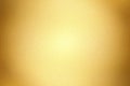 Glowing gold painted metal wall with copy space, abstract texture background Royalty Free Stock Photo