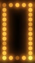 Glowing golden bulbs forming a rectangular frame on dark background, vintage marquee theater style Royalty Free Stock Photo