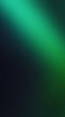 Glowing green blurred light gradient dark grainy black vertical background glowing light spot copy space