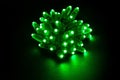 Glowing green led pixels christmas holiday lights on black background Royalty Free Stock Photo