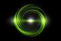 Glowing green spiral with light circle on black sky backdrop, abstract background Royalty Free Stock Photo