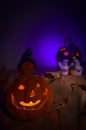 Glowing Halloween pumpkin and ghosts