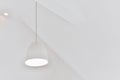 Glowing hanging lamp in minimalist room