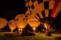 glowing hot air balloons at night