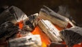 Glowing Hot Charcoal In BBQ Grill Pit With Flames, Close-up. Burning coals close up Royalty Free Stock Photo