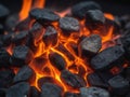 Glowing Hot Coals and Embers in a Dark Ashy Fire Pit. Royalty Free Stock Photo