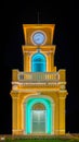 Glowing and illuminated Clock tower on a roundabout in old phuket town at night phuket thailand.