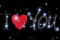 glowing inscription I love you on the starry sky with a red heart, black background Royalty Free Stock Photo