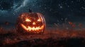 Glowing Jack-o\'-Lantern in a Field Under a Starry Night Sky Royalty Free Stock Photo