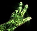 Glowing kirlian aura photography with green corona of a male human hand