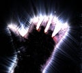Glowing kirlian aura photography of a human male hand showing different signs and symbols