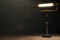 Glowing lamp in the style of steampunk on a wooden table