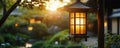 Glowing lantern illuminated at twilight in a serene garden setting Royalty Free Stock Photo