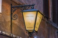 Glowing lantern with the inscription Wine on the street of Venice