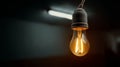 Glowing Light Bulb in Dark Room Royalty Free Stock Photo