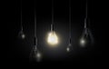 Glowing light bulb is hanging between a lot of turned off light bulbs on dark black background, copyspace, transparent vector Royalty Free Stock Photo