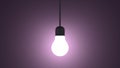 Glowing light bulb in lamp socket hanging on violet