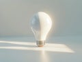 Glowing light bulb on a minimalist background Royalty Free Stock Photo