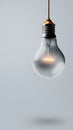Glowing Light Bulb on a Minimalist Background Royalty Free Stock Photo
