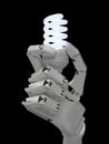 Glowing light bulb in robot hand Royalty Free Stock Photo