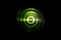 Glowing light green vortex on black backdrop, abstract background Royalty Free Stock Photo