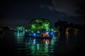 glowing lights peek out of the dark, surreal float island