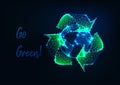 Glowing low polygonal Earth globe and green recycle sign and text message Go green on dark blue. Royalty Free Stock Photo