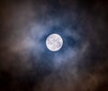 Glowing bright full moon with dark clouds Royalty Free Stock Photo