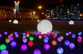 Glowing multi-colored balls, a festive decoration of the city