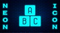 Glowing neon ABC blocks icon isolated on brick wall background. Alphabet cubes with letters A,B,C. Vector Illustration Royalty Free Stock Photo