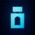 Glowing neon Aftershave icon isolated on brick wall background. Cologne spray icon. Male perfume bottle. Vector Royalty Free Stock Photo