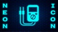 Glowing neon Ampere meter, multimeter, voltmeter icon isolated on brick wall background. Instruments for measurement of