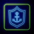 Glowing neon Anchor inside shield icon isolated on blue background. Vector Royalty Free Stock Photo