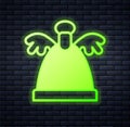 Glowing neon Angel icon isolated on brick wall background. Merry Christmas and Happy New Year. Vector