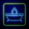 Glowing neon Aroma candle icon isolated on blue background. Vector