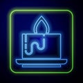 Glowing neon Aroma candle icon isolated on blue background. Vector