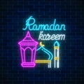 Glowing neon banner of ramadan islamic holy month. Ramadan greeting card with fanus lantern and mosque. Royalty Free Stock Photo