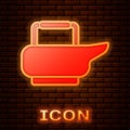 Glowing neon Bedpan icon isolated on brick wall background. Toilet for bedridden patients. Vector Illustration