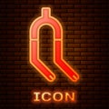 Glowing neon Bicycle suspension fork icon isolated on brick wall background. Sport transportation spare part steering