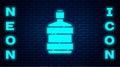 Glowing neon Big bottle with clean water icon isolated on brick wall background. Plastic container for the cooler Royalty Free Stock Photo