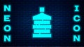 Glowing neon Big bottle with clean water icon isolated on brick wall background. Plastic container for the cooler Royalty Free Stock Photo